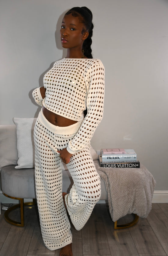 Cream crochet trousers and long sleeved crop top co-ord