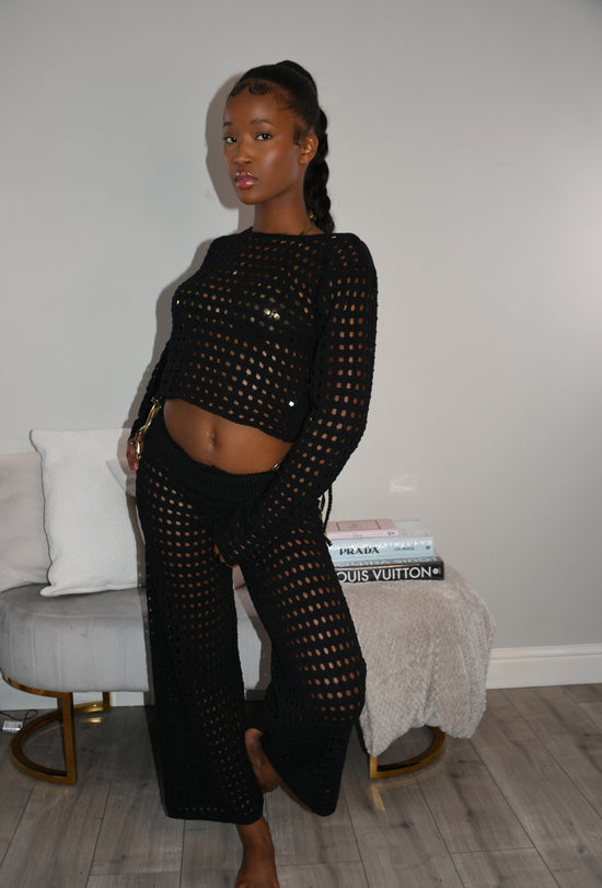 Black crochet trousers and long sleeved crop top co-ord